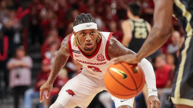 Razorbacks guard El Ellis defending against Purdue on Saturday